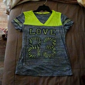 A grey and lime green short sleeve shirt